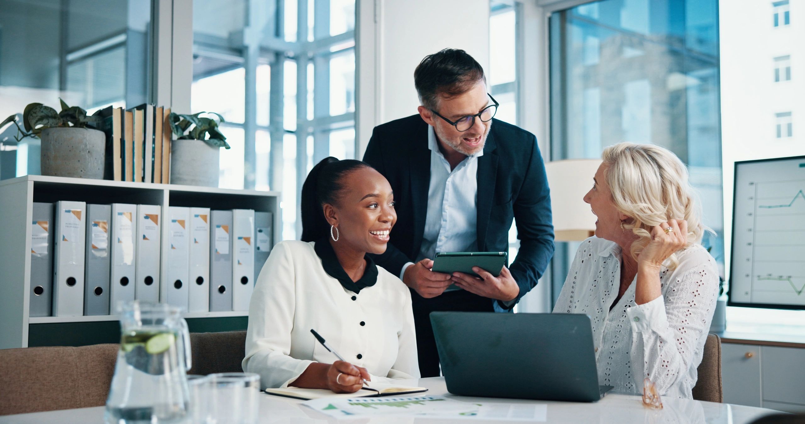TrueNorth-HR consultants collaborating in a modern office setting